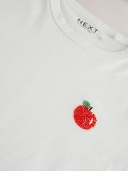 White Graphic Fruit Beaded - Essential Kurzarm-T-Shirt aus reiner Baumwolle mit Rundhalsausschnitt - Bild 7 von 8