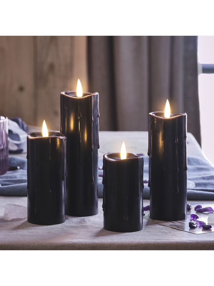 Lights4fun 4 TruGlow® Black Wax LED Slim Pillar Candles - Image 1 of 2