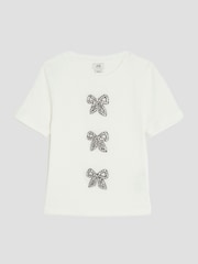 River Island Cream Girls Ribbed Bow T-Shirt - Image 1 of 4