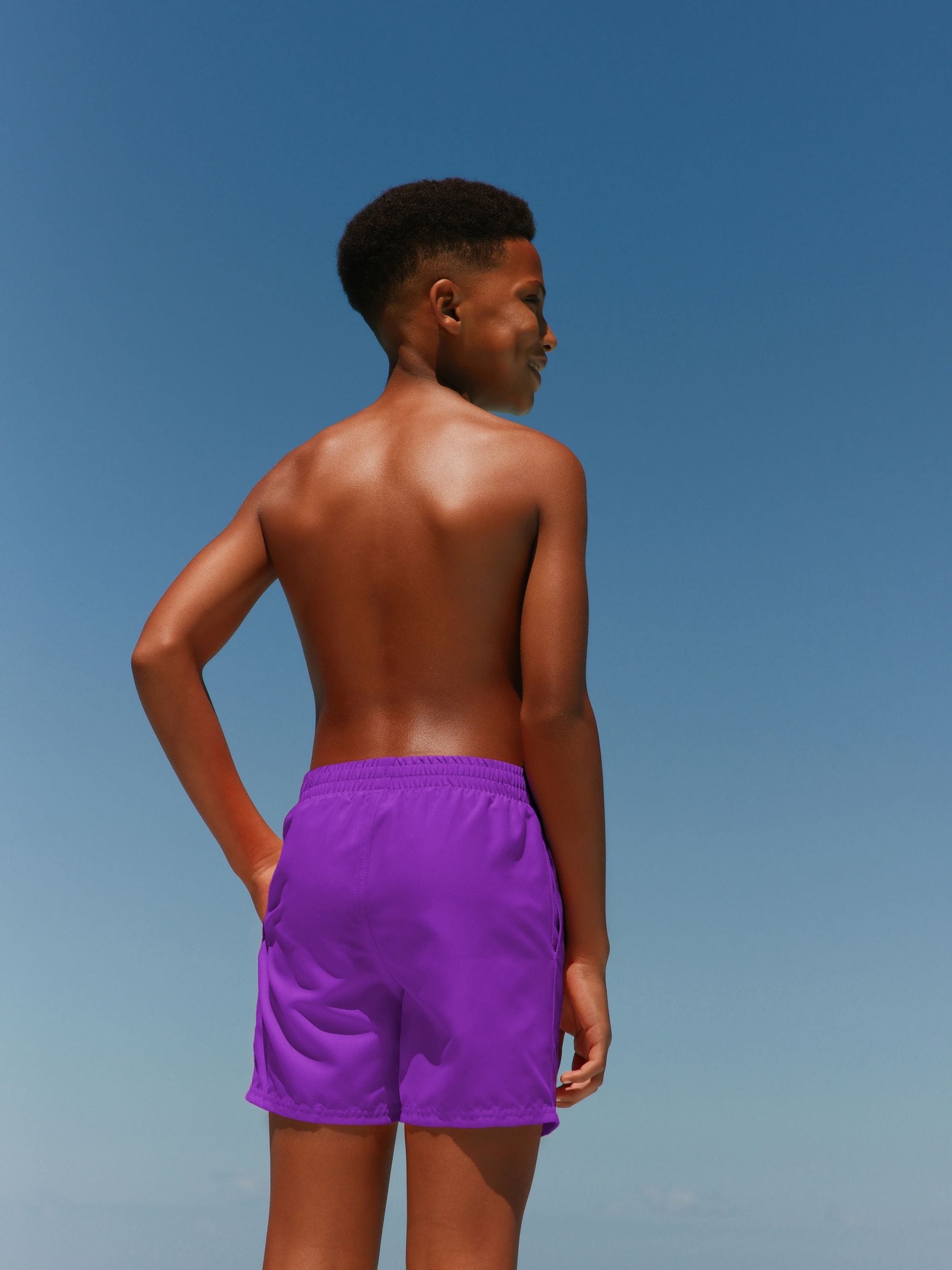 purple nike swim trunks