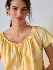 Butter Yellow Polka Dot Short Sleeve Bubblehem Scoop Neck T-Shirt - Image 1 of 8