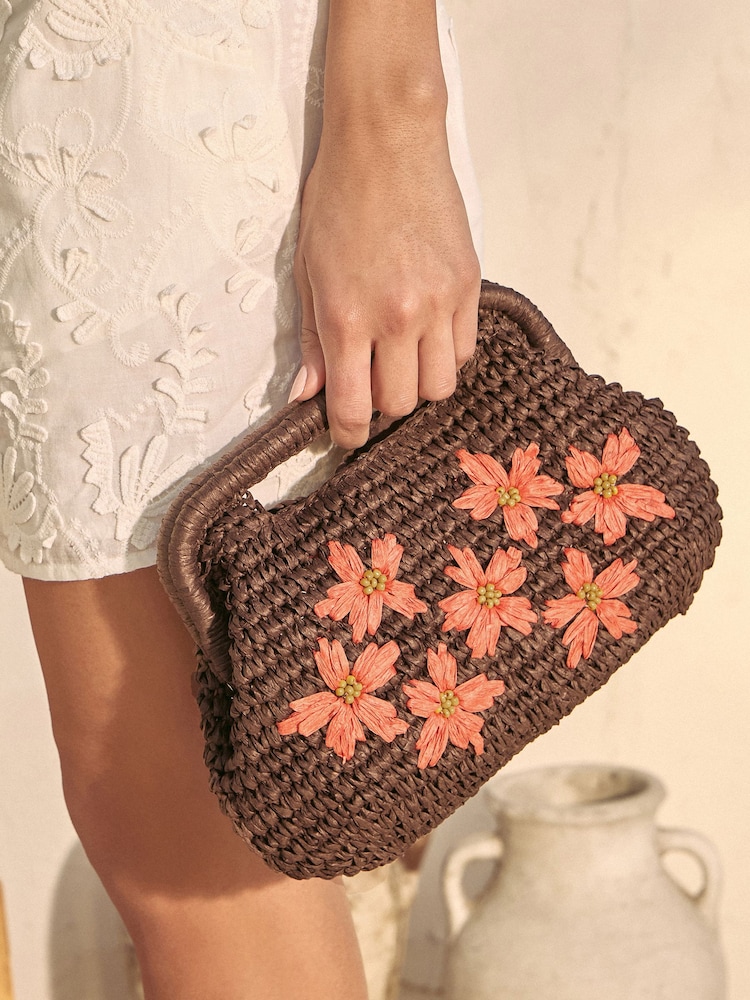 Love & Roses Chocolate Brown Floral Raffia Top Handle Clutch Bag - Image 1 of 5 Love & Roses Chocolate Brown Floral Raffia Top Handle Clutch Bag - Image 1 of 5