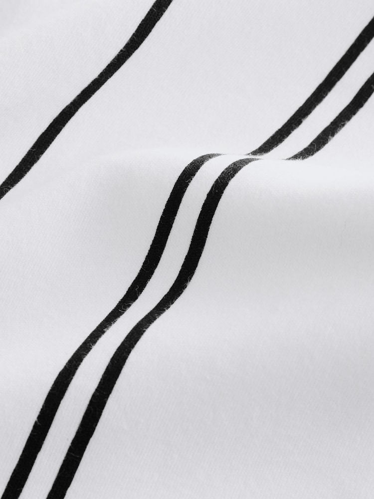 Blanco/Negro - Polo con cuello y cremallera a rayas verticales (3-16 años) - Imagen 4 de 4