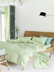 Designers Guild Willow Green Loweswater 300 Thread Count Duvet Cover and Pillowcase Set - Image 1 of 4