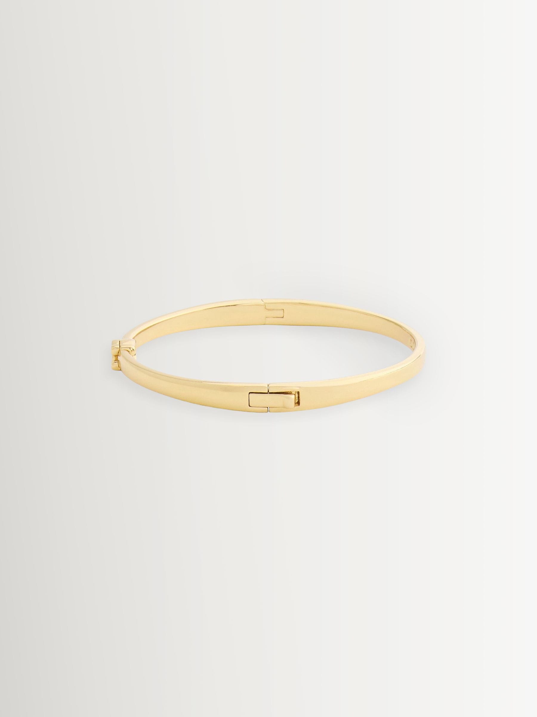 Buy COACH Gold Tone Signature C Bangle Boxed Bracelet from Next Canada