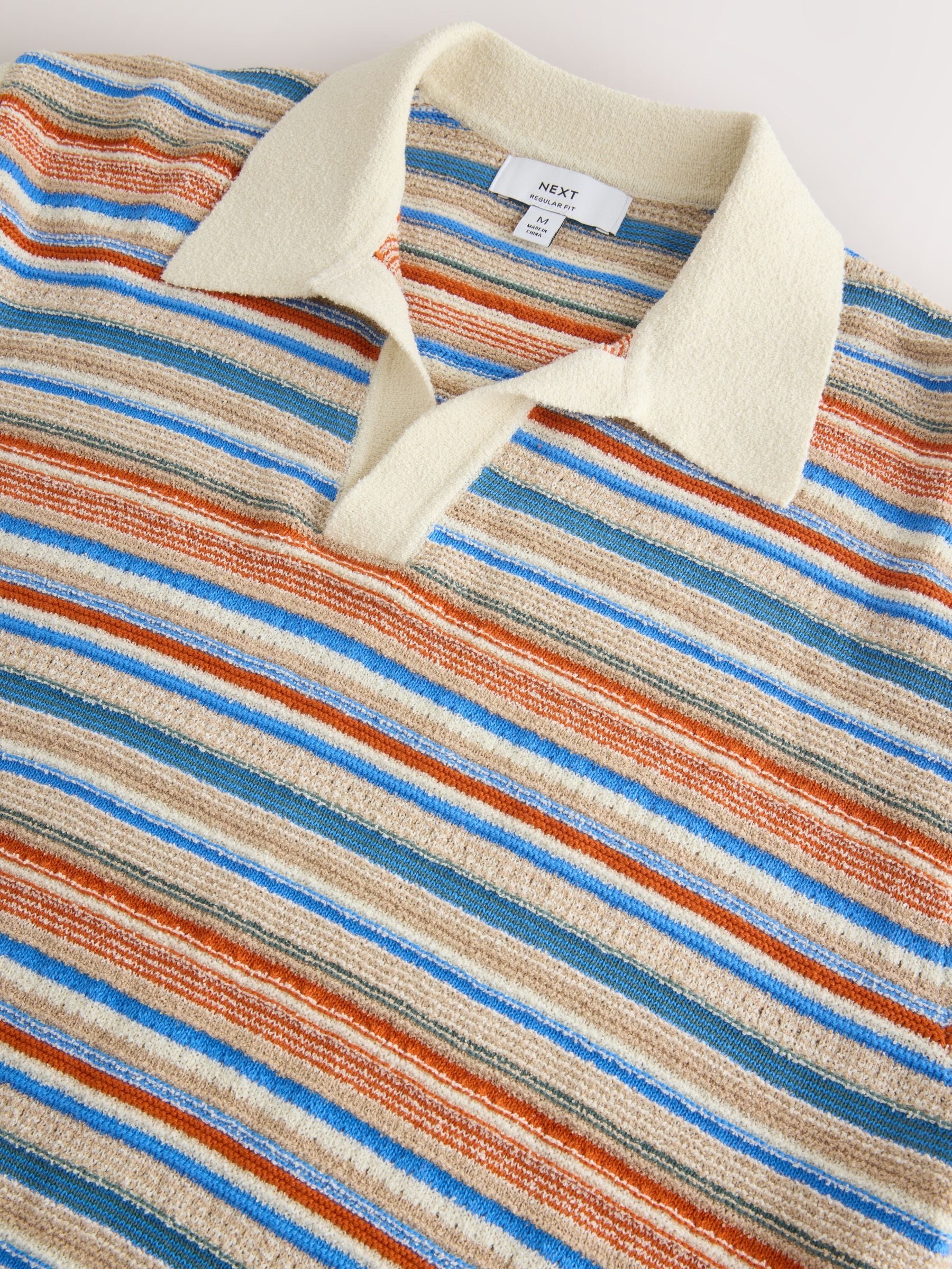 Buy White/Multi Boucle Stripe Knit Trophy Polo Shirt from the Next