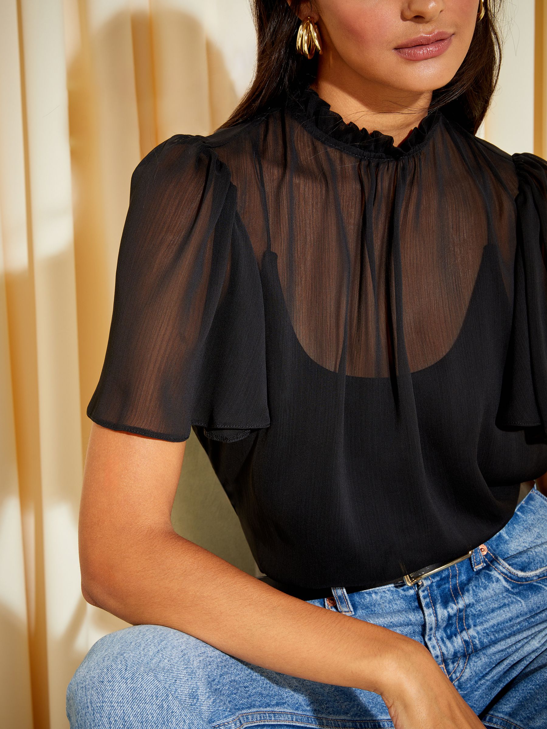 Black sheer ruffle top deals