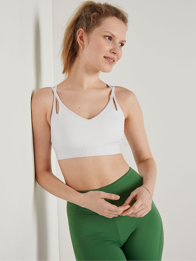 Victoria's Secret PINK Optic White Ultimate Strappy Back Lightly Lined Bra - Image 1 of 1 Victoria's Secret PINK Optic White Ultimate Strappy Back Lightly Lined Bra - Image 1 of 1