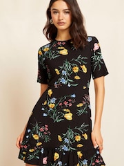 Friends Like These Black Ditsy Petite Short Sleeve Round Neck Ruffle Hem Mini Dress - Image 1 of 4