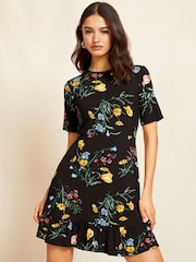 Friends Like These Black Floral Print Short Sleeve Ruffle Hem Jersey Mini Dress - Image 1 of 4