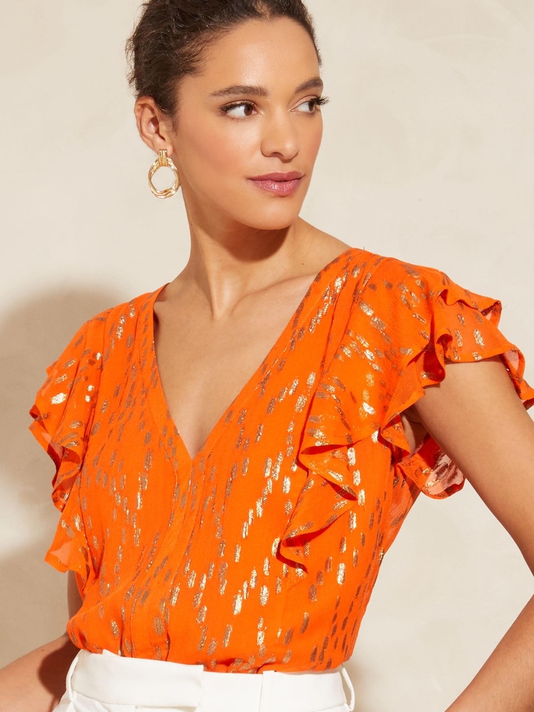 Love & Roses Orange Petite Metallic V Neck Ruffle Tie Back Top - Image 1 of 4