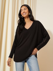 Friends Like These Black Crochet Soft Jersey V Neck Long Sleeve Tunic Top - Image 1 of 4