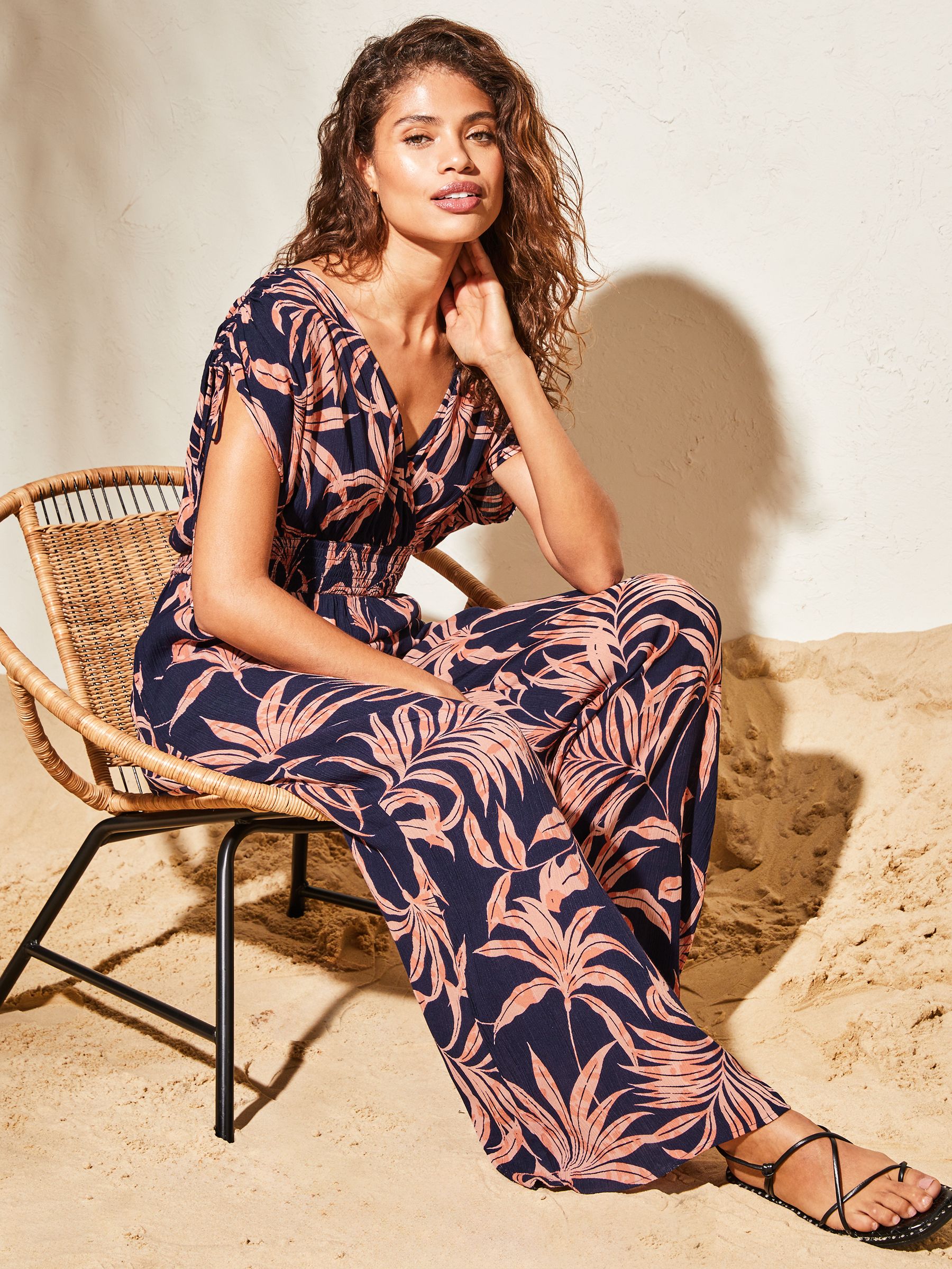 Buy Lipsy Navy Blue Palm Print Petite V Neck Wrap Holiday Shop Jumpsuit from Next Luxembourg