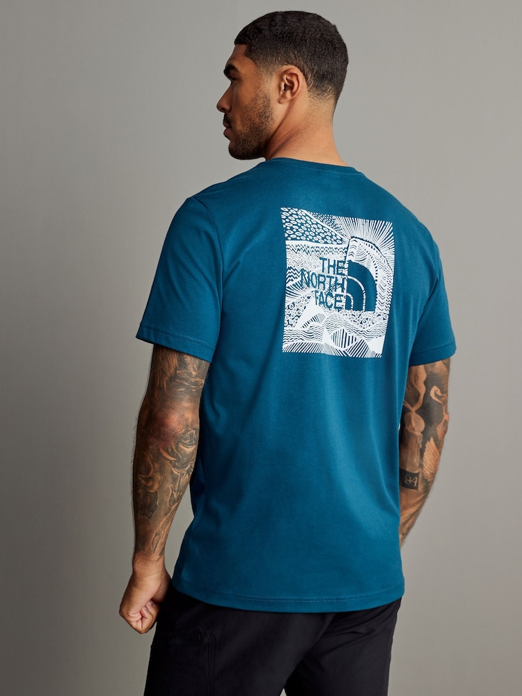 The North Face Blue Short Sleeve Celebration Redbox 100% Cotton T-Shirt - Image 1 of 4 The North Face Blue Short Sleeve Celebration Redbox 100% Cotton T-Shirt - Image 1 of 4