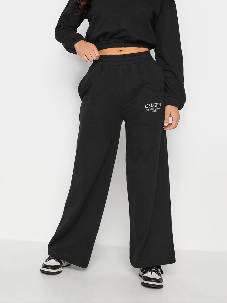 PixieGirl Petite Black Los Angeles Embroidered Wide Leg 100% Cotton Joggers - Image 1 of 4