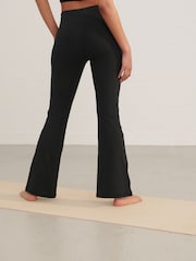Negro - Leggings acampanados con cintura cruzada Active - Imagen 4 de 7