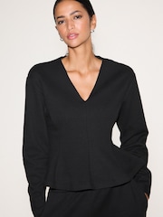 Black Long Sleeved V-Neck Peplum Knit Look Top - Image 1 of 5