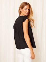 Friends Like These Black Petite Ruffle Sleeve Tie Front Cutwork Embroidered Blouse - Image 4 of 4