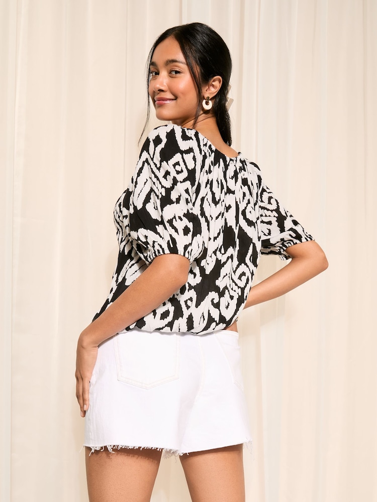 Friends Like These Black and White Ikat Tie Neck Bubble Hem Puff Sleeve Top - Image 4 of 4