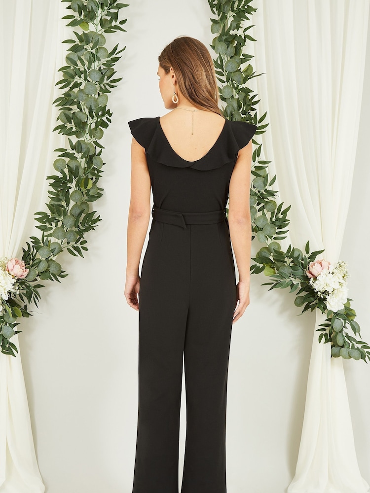 Mela Black Jumpsuit With Gold Buckle and Frill Detail - Image 2 of 5