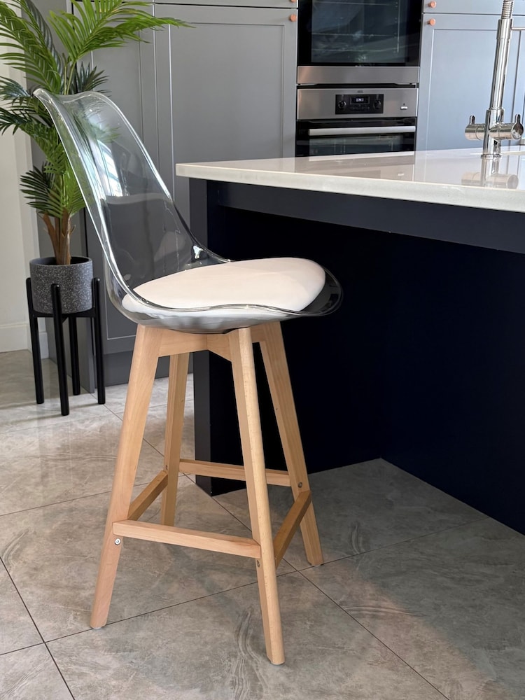 Fusion Living White Soho Clear Plastic Bar Stool with Light Wood Legs - Image 1 of 5 Fusion Living White Soho Clear Plastic Bar Stool with Light Wood Legs - Image 1 of 5