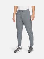 Серый - Nike Unlimited Спортивные брюки на молнии Dri-FIT - Изображение 1 из 12