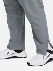 Серый - Nike Unlimited Спортивные брюки на молнии Dri-FIT - Изображение 10 из 12