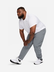 Серый - Nike Unlimited Спортивные брюки на молнии Dri-FIT - Изображение 12 из 12