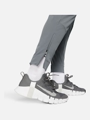 Серый - Nike Unlimited Спортивные брюки на молнии Dri-FIT - Изображение 5 из 12