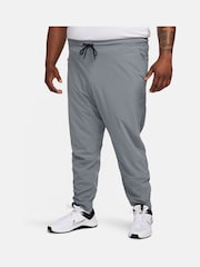Серый - Nike Unlimited Спортивные брюки на молнии Dri-FIT - Изображение 7 из 12
