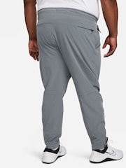 Серый - Nike Unlimited Спортивные брюки на молнии Dri-FIT - Изображение 8 из 12