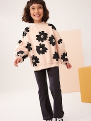 Schwarz geblümt - Set aus Sweatshirt und gerippter Schlaghose (3-16 Jahre) - Bild 1 von 5