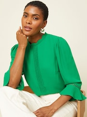 Love & Roses Green Scallop Pintuck Flute Sleeve Blouse - Image 1 of 4