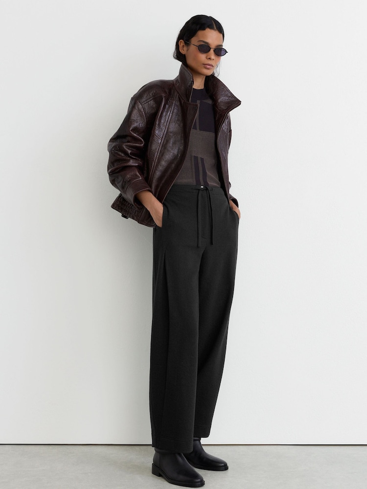 Reiss Black Leoni Cotton-Blend Barrel-Leg Drawstring Trousers - Image 1 of 6 Reiss Black Leoni Cotton-Blend Barrel-Leg Drawstring Trousers - Image 1 of 6