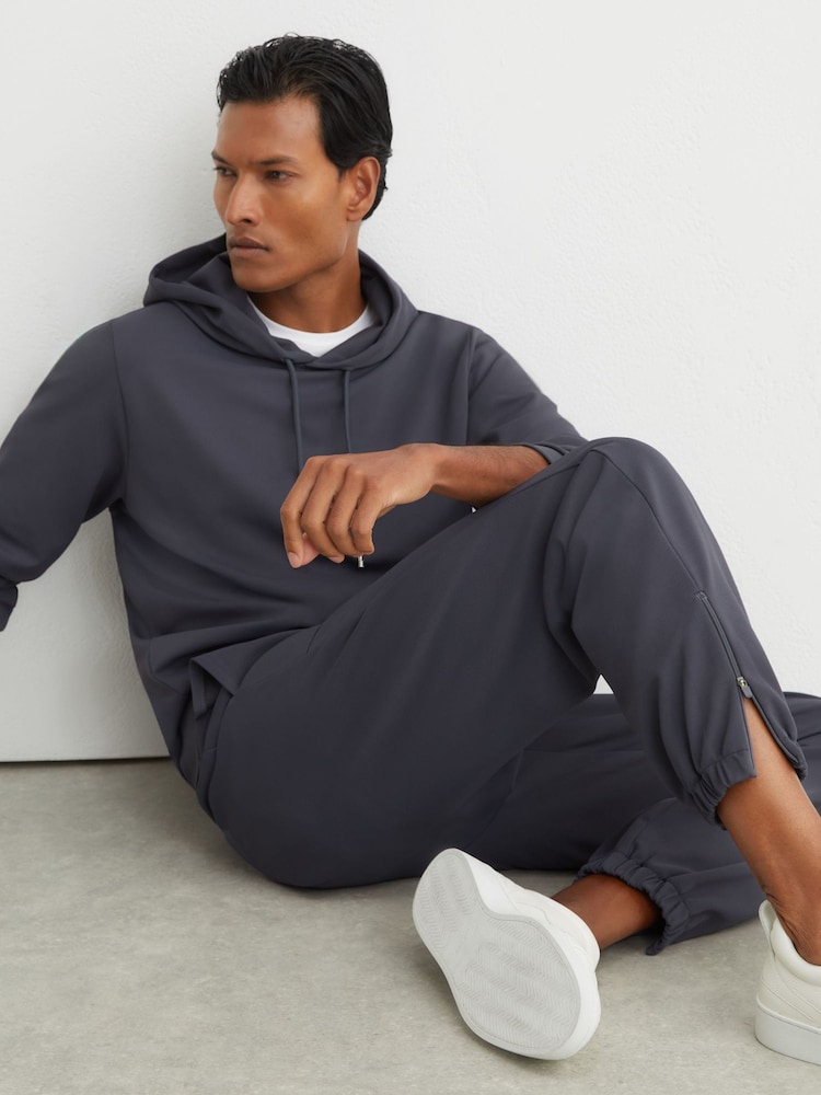 Reiss Airforce Blue Crescent R-Flex Stretch-Twill Cuffed Joggers - Image 1 of 9 Reiss Airforce Blue Crescent R-Flex Stretch-Twill Cuffed Joggers - Image 1 of 9