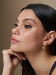 Orelia London Gold Tone Interlocking Halo Pavé Earrings - Image 1 of 2