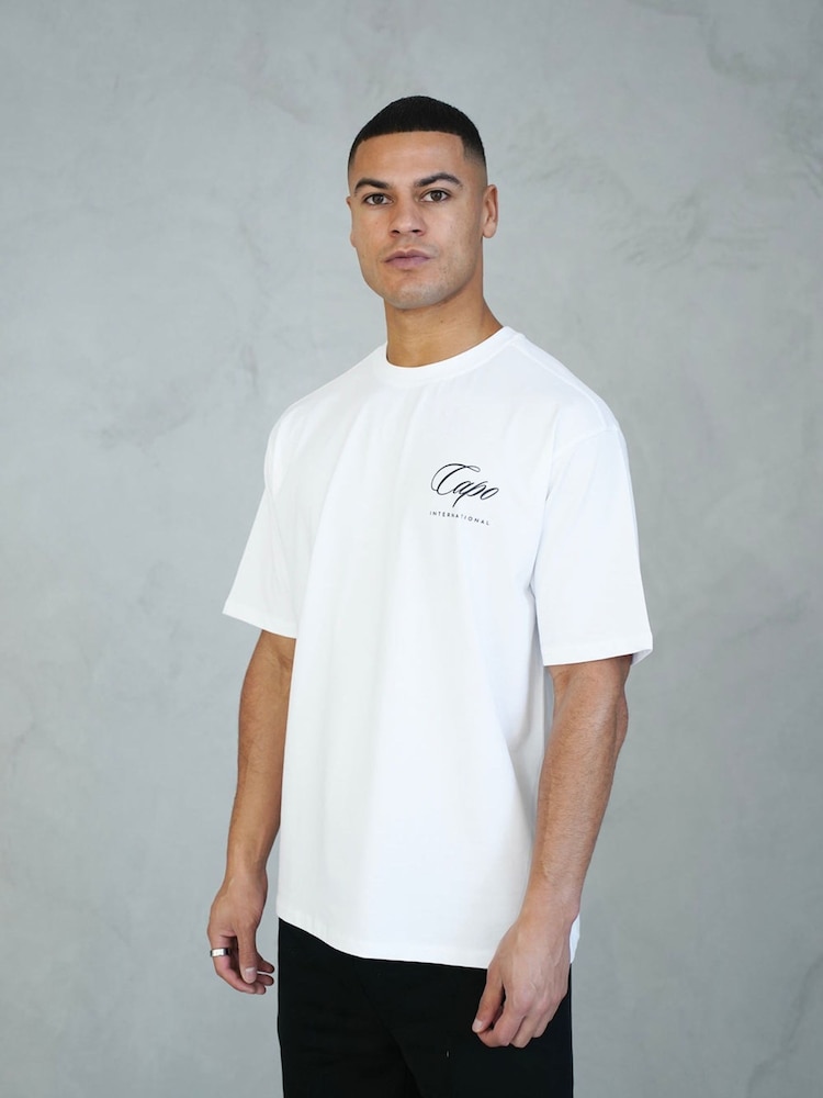 Puti - CAPO International T-Shirt - Larawan 1 ng 5