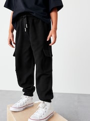 Negro - Pantalones de chándal cargo estilo utilitario (3-16 años) - Imagen 1 de 5