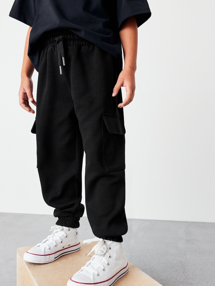 Schwarz - Cargo Utility Jogginghosen (3-16 Jahre) - Bild 1 von 5 Schwarz - Cargo Utility Jogginghosen (3-16 Jahre) - Bild 1 von 5