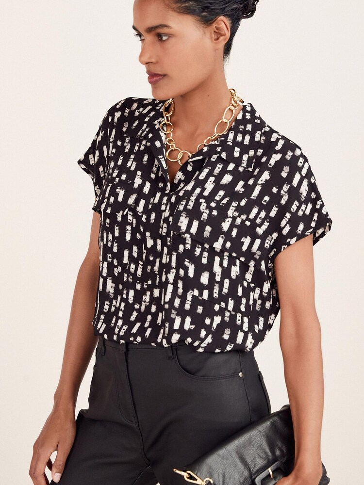 Schwarz/Weiß/Strichmuster - Utility-Oberteil mit Flügelärmeln - Bild 1 von 4 Schwarz/Weiß/Strichmuster - Utility-Oberteil mit Flügelärmeln - Bild 1 von 4