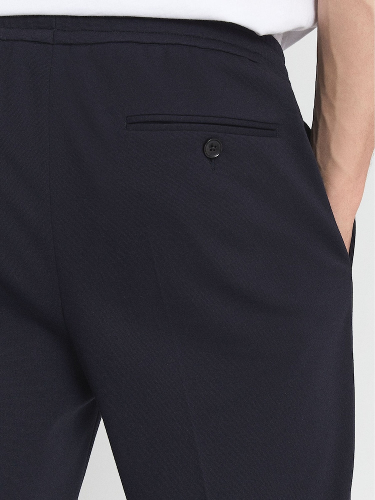 Pantalones elásticos de punto y corte slim Flexo de Reiss - Imagen 6 de 6