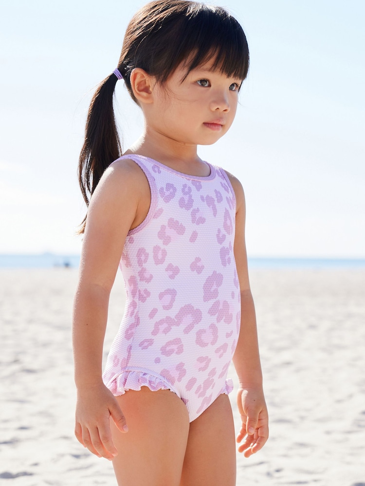 Violett mit Animalprint - Badeanzug mit Rüschen (3 Monate–10 Jahre) - Bild 1 von 7 Violett mit Animalprint - Badeanzug mit Rüschen (3 Monate–10 Jahre) - Bild 1 von 7