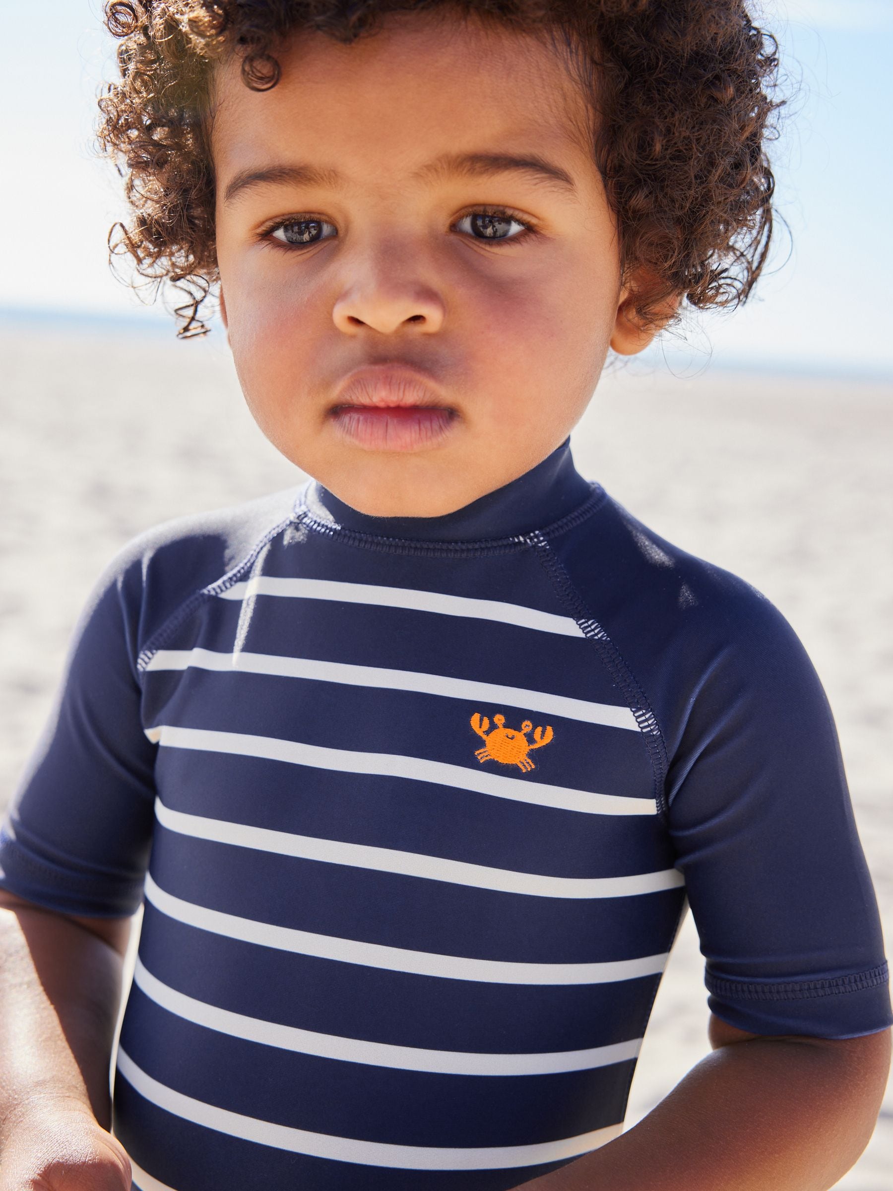 Buy Navy Stripe Sunsafe All-In-One Swimsuit (3mths-7yrs) from Next