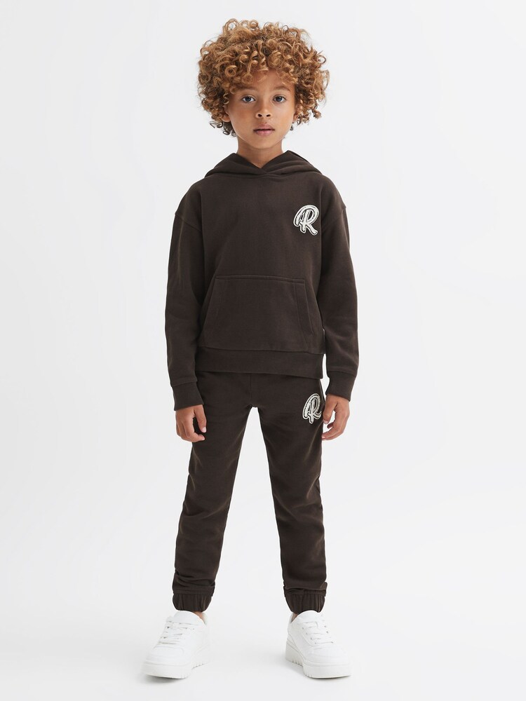 Reiss Chocolate Cade Junior Relaxed Garment Dyed Logo Hoodie - Image 1 of 6 Reiss Chocolate Cade Junior Relaxed Garment Dyed Logo Hoodie - Image 1 of 6