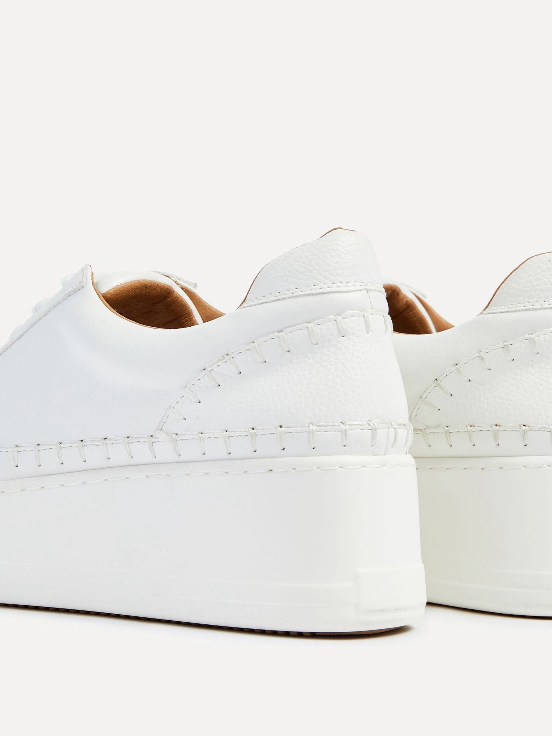 White leather platform trainer top