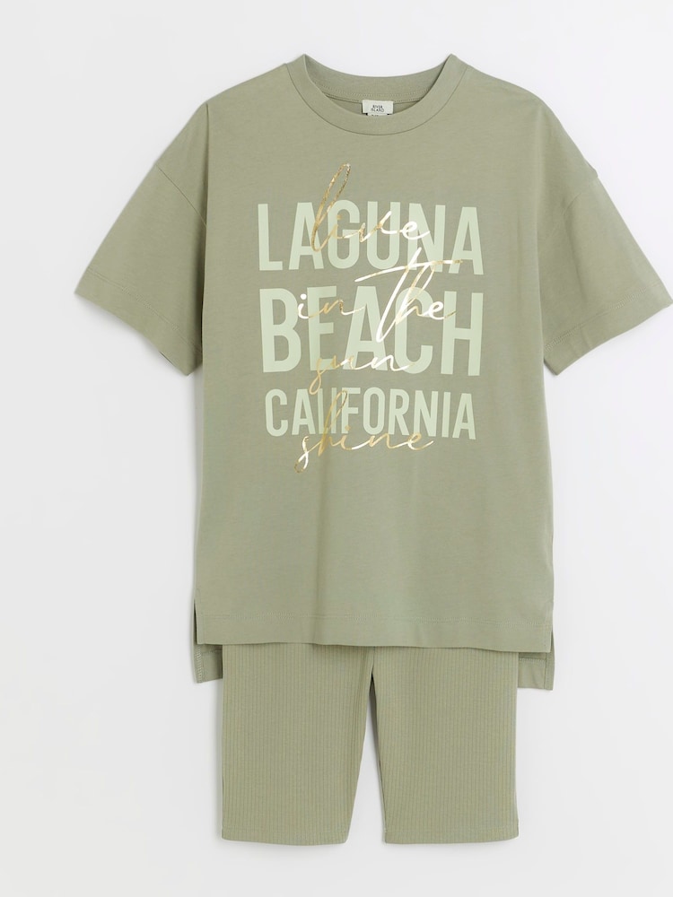 River Island Green Girls Laguna 100% Cottton T-Shirt And Cycling Shorts Set - Image 1 of 5 River Island Green Girls Laguna 100% Cottton T-Shirt And Cycling Shorts Set - Image 1 of 5