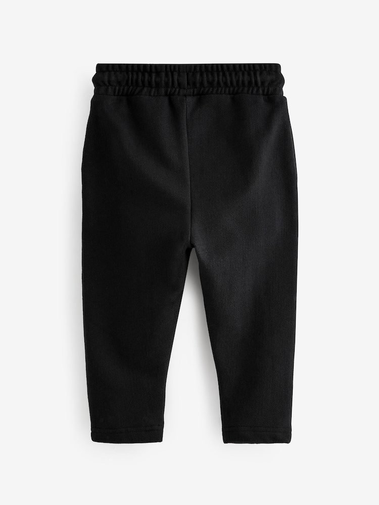 Black Pintuck 100% Cotton Joggers (3mths-7yrs) - Image 2 of 3 Black Pintuck 100% Cotton Joggers (3mths-7yrs) - Image 2 of 3