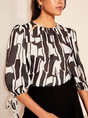 Friends Like These Black/White 3/4 Sleeve Chiffon Tie Cuff Blouse - Image 1 of 4