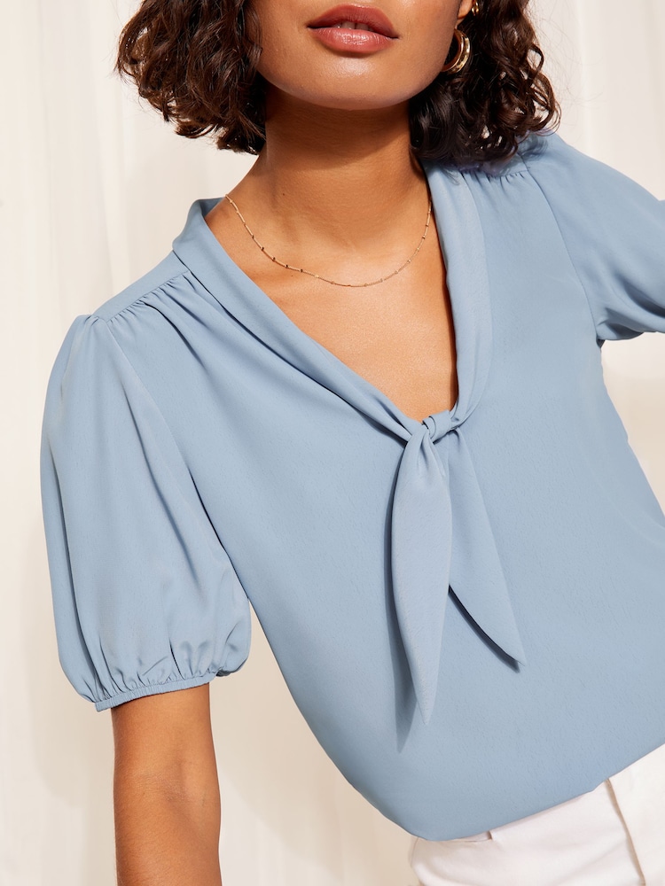 Friends Like These Navy Blue Short Sleeve Bow Front Crepe Blouse - Image 1 of 4 Friends Like These Navy Blue Short Sleeve Bow Front Crepe Blouse - Image 1 of 4