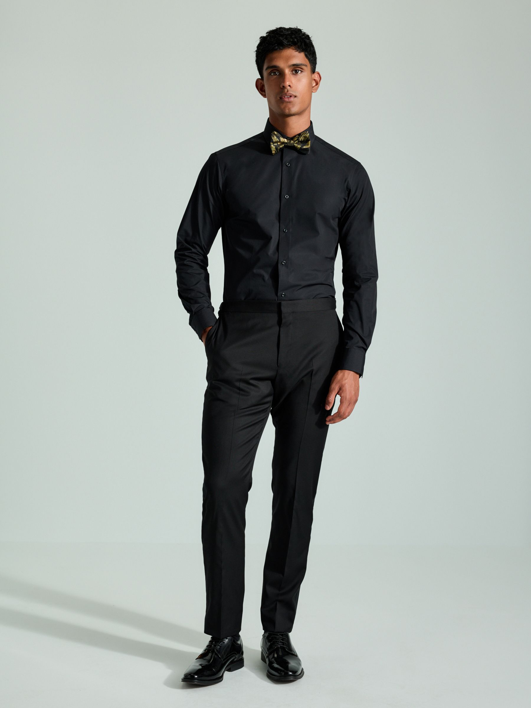 black dress shirt with black bow tie